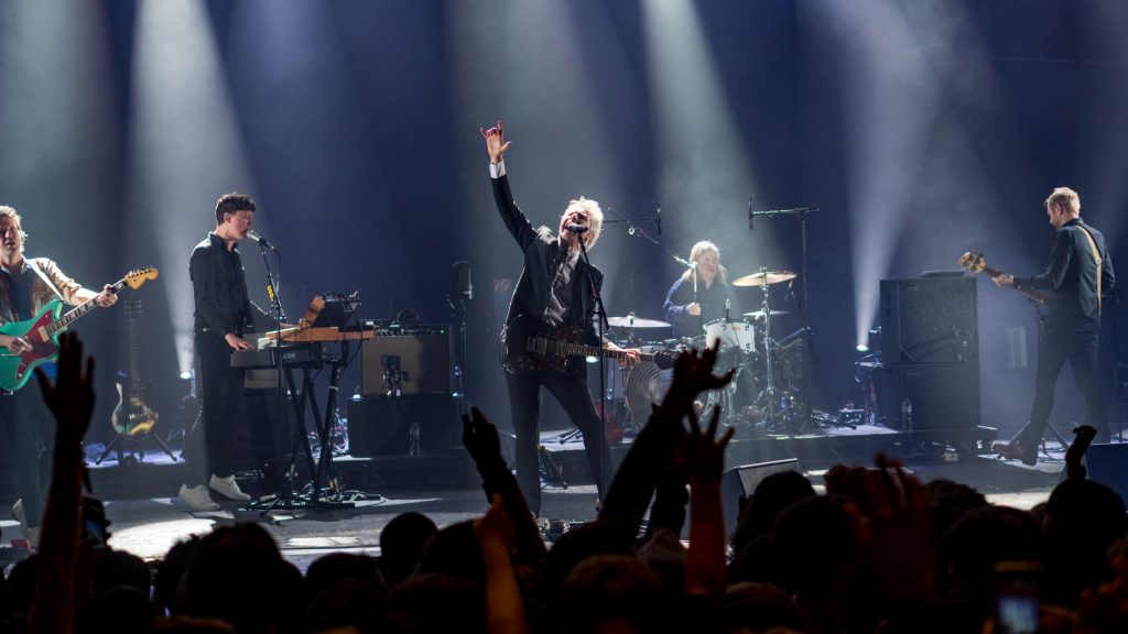 Franz Ferdinand performing live in 2018. From left to right: Bardot, Corrie, Kapranos, Thomson, and Hardy.